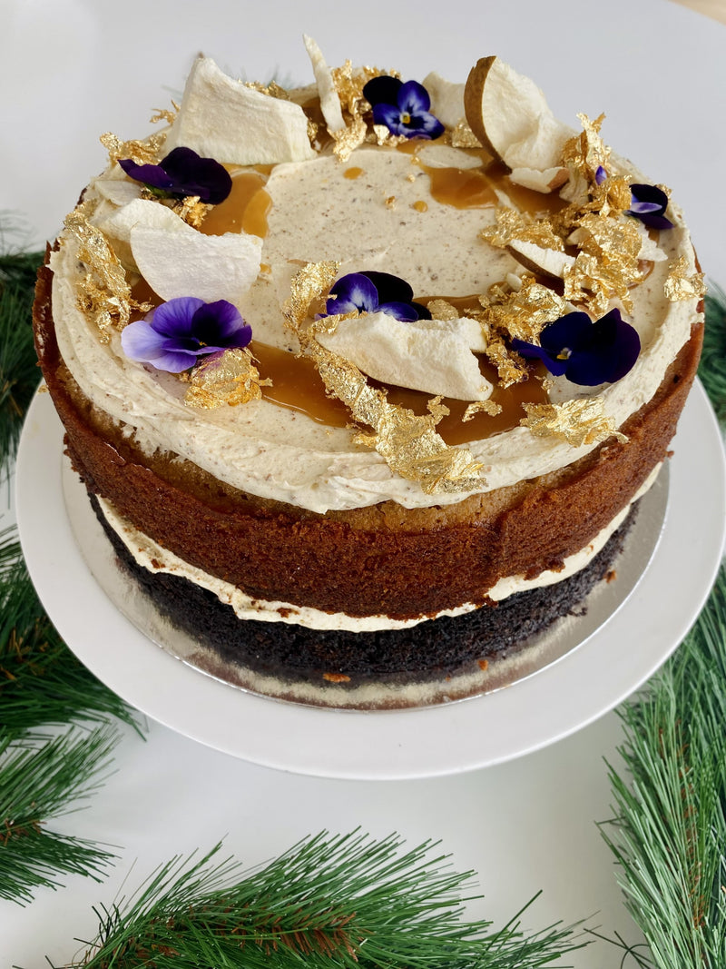 Caramelised pear and dark chocolate cake, creamy chocolate mousse, ginger buttercream, salted caramel, edible gold leaf & flowers